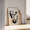 Dynamic scene of jazz dancers in motion, featuring black and orange hues - leaning on a herringbone floor against a white panelled wall