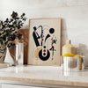 Dynamic scene of jazz dancers in motion, featuring black and orange hues - styled on a counter with eucalyptus and a bowl of lemons