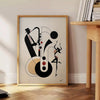 Dynamic scene of jazz dancers in motion, featuring black and orange hues - beside a round wooden side table with books