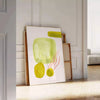 Colorful kitchen scene with green and orange elements, culinary theme - leaning on a herringbone floor against a white panelled wall