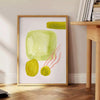 Colorful kitchen scene with green and orange elements, culinary theme - beside a round wooden side table with books