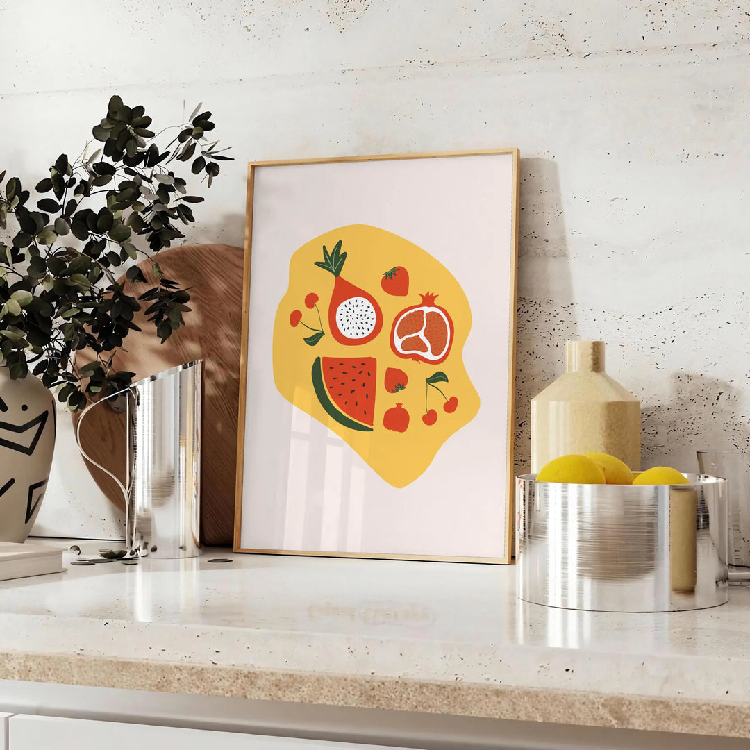 Una scena di cucina colorata con elementi verdi e arancioni, che presenta utensili e ingredienti culinari - su un piano con eucalipto e una ciotola di limoni