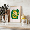 A modern kitchen scene featuring green and white colors with minimalist design elements - styled on a counter with eucalyptus and a bowl of lemons