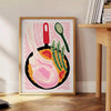 Bold black and orange kitchen-themed design with abstract shapes - beside a round wooden side table with books