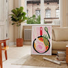 Bold black and orange kitchen-themed design with abstract shapes - in a Parisian living room with a sofa and a fig plant