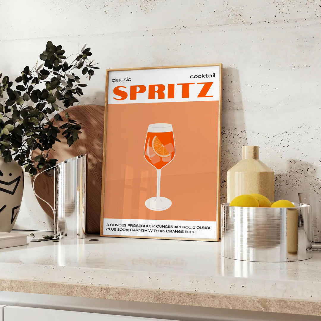 A sleek black background with a vibrant orange cocktail spritz illustration - styled on a counter with eucalyptus and a bowl of lemons