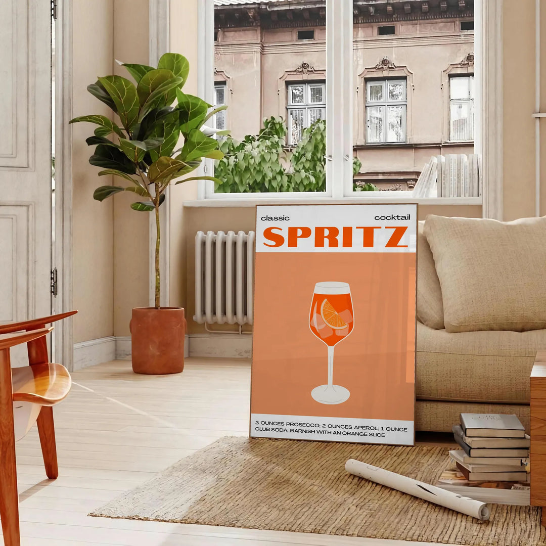 A sleek black background with a vibrant orange cocktail spritz illustration - in a Parisian living room with a sofa and a fig plant