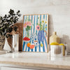 A colorful kitchen scene featuring orange and blue hues in a modern style - styled on a counter with eucalyptus and a bowl of lemons