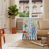 A colorful kitchen scene featuring orange and blue hues in a modern style - in a Parisian living room with a sofa and a fig plant