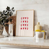 A modern kitchen scene with gray tones and red accents - styled on a counter with eucalyptus and a bowl of lemons