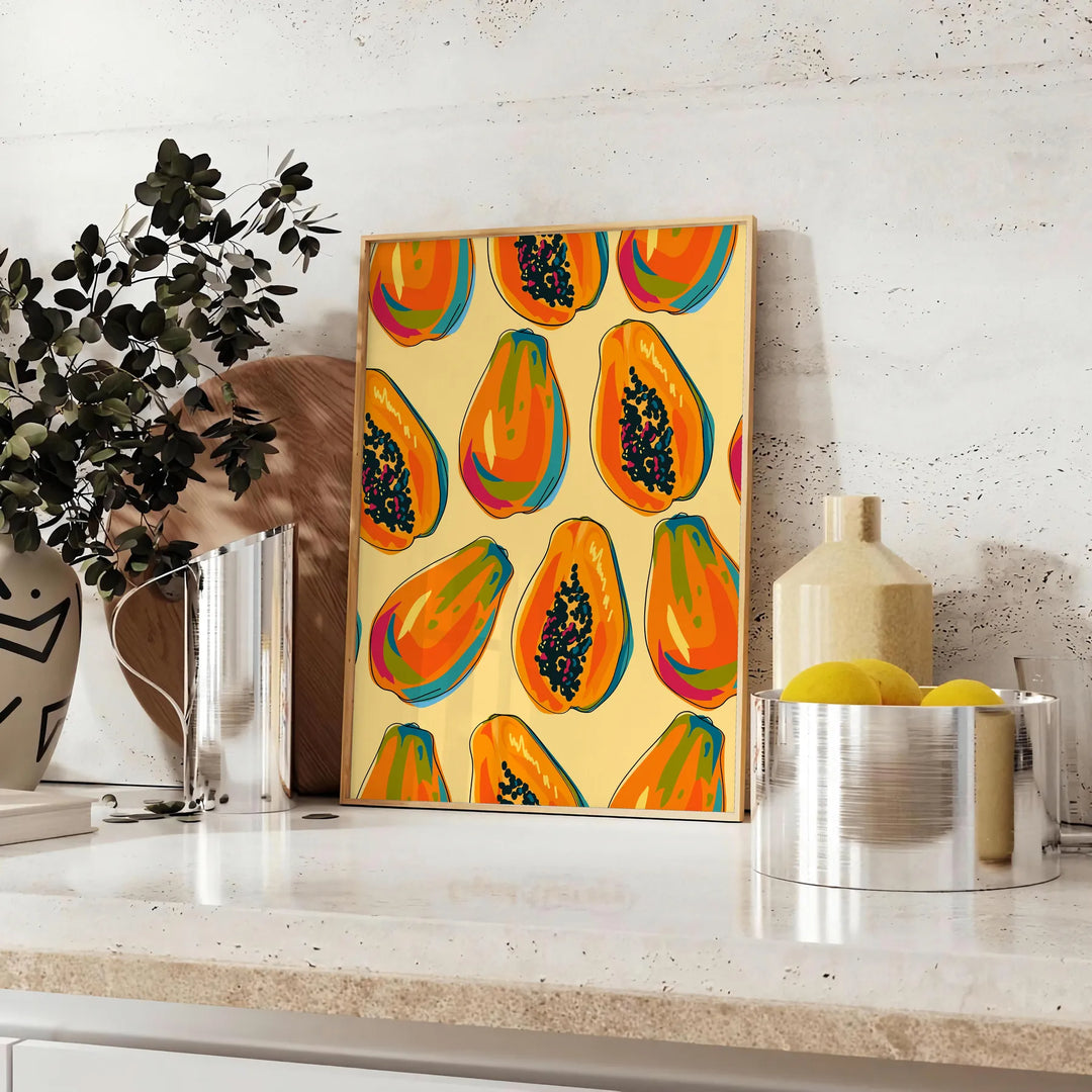 En färgglad köksbild med gröna och orange nyanser - på en bänk med eukalyptus och en skål citroner