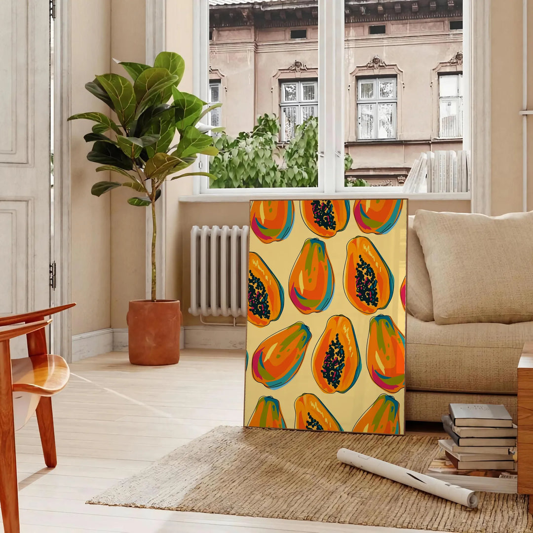En färgglad köksbild med gröna och orange nyanser - i ett parisiskt vardagsrum med soffa och en fikus