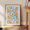 A colorful kitchen scene with green and blue hues - beside a round wooden side table with books