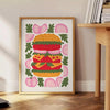 Abstract kitchen scene with green and orange colors - beside a round wooden side table with books