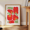 A colorful kitchen scene with green and red elements. - beside a round wooden side table with books