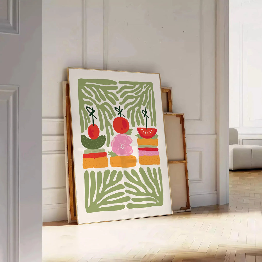 A colorful kitchen print featuring shades of green and orange - leaning on a herringbone floor against a white panelled wall