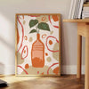 Contemporary kitchen scene with bold orange and gray tones - beside a round wooden side table with books