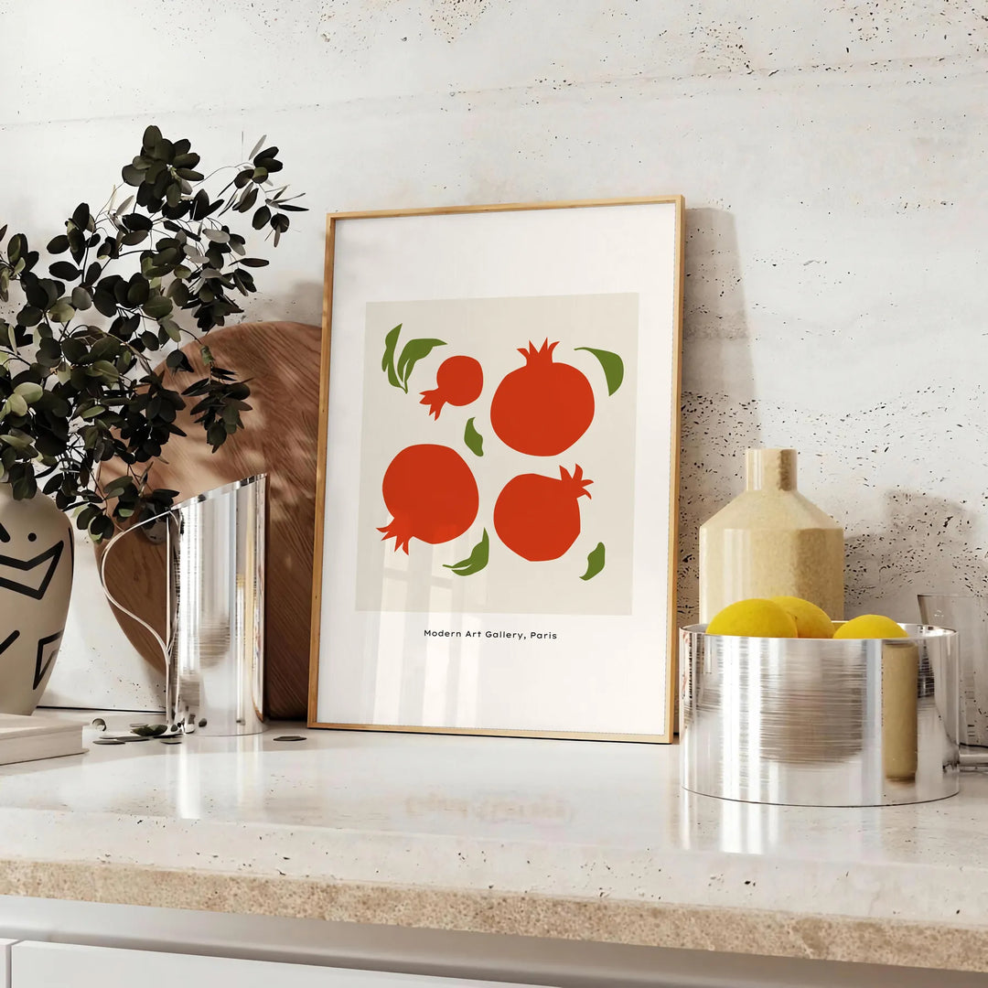 A kitchen scene with gray and green tones, featuring utensils and decor elements - styled on a counter with eucalyptus and a bowl of lemons