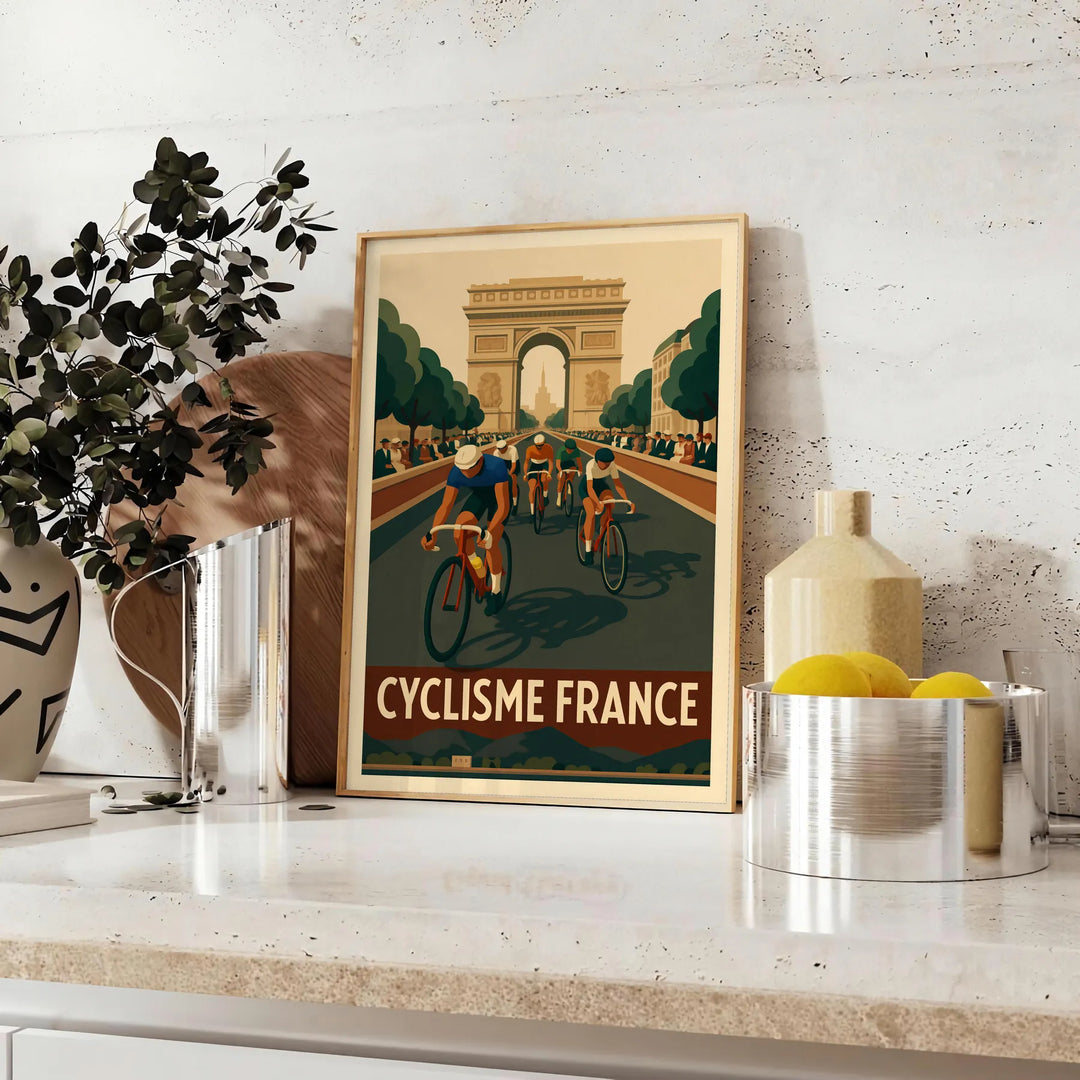 Stylized cyclist racing through green and brown landscapes for Tour de France - styled on a counter with eucalyptus and a bowl of lemons