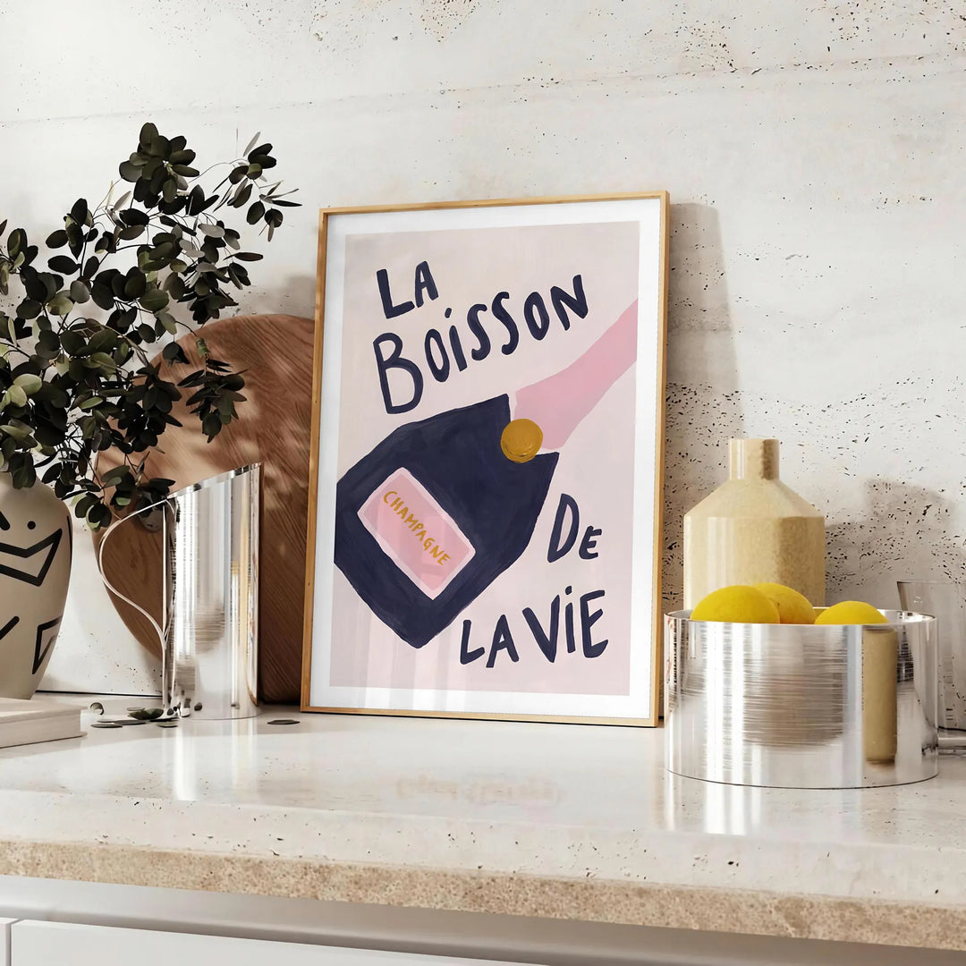 A colorful illustration of a champagne cocktail with orange and blue hues - styled on a counter with eucalyptus and a bowl of lemons