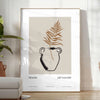 Colorful boho poster featuring abstract shapes and patterns in green and black - in a bright minimalist room with a plant and an armchair