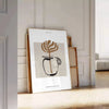 Abstract boho design featuring earthy tones and minimalist shapes - leaning on a herringbone floor against a white panelled wall