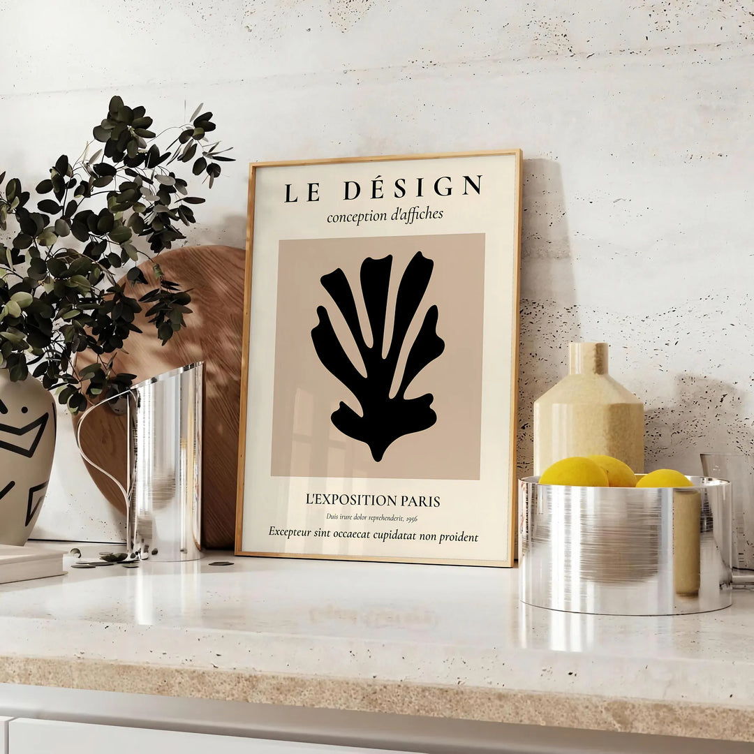 Maximalist design featuring bold black and orange colors in an abstract composition - styled on a counter with eucalyptus and a bowl of lemons