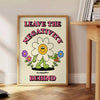 A groovy poster featuring bold yellow and black colors with a space theme and motivational text. - beside a round wooden side table with books