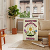 A groovy poster featuring bold yellow and black colors with a space theme and motivational text. - in a Parisian living room with a sofa and a fig plant