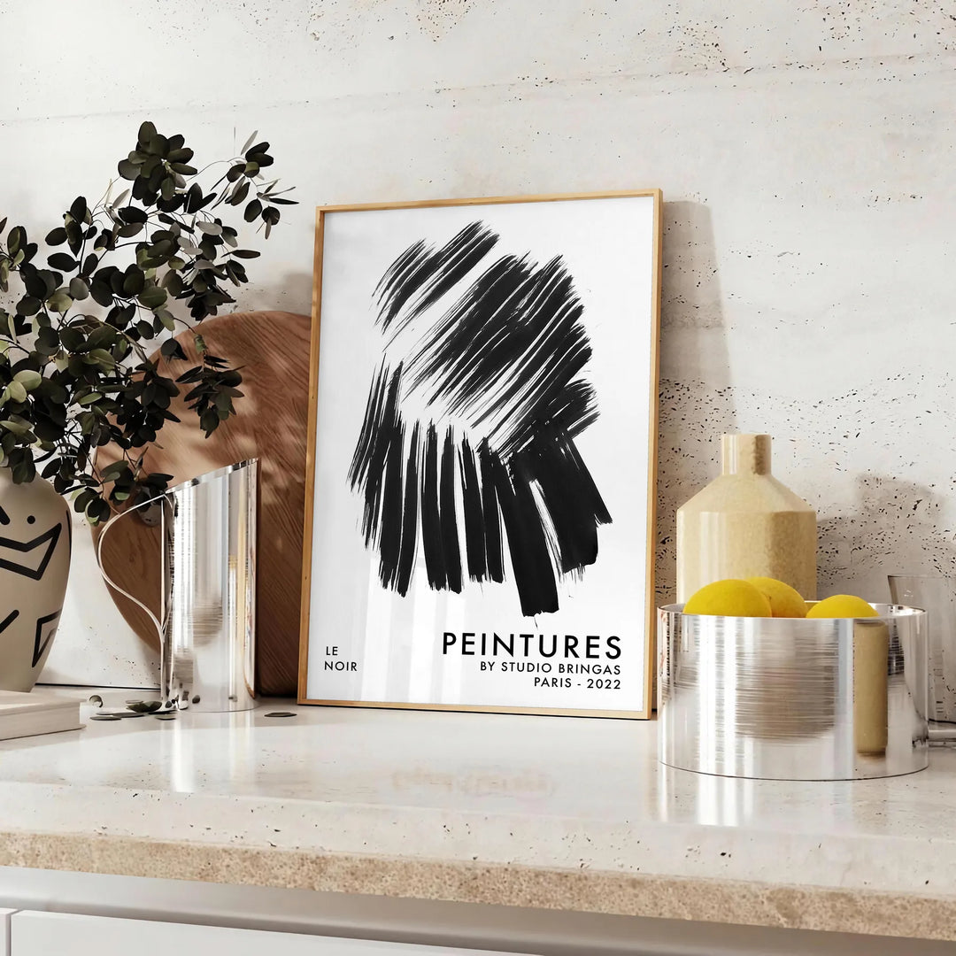 Maximalist wall art featuring bold black and blue hues - styled on a counter with eucalyptus and a bowl of lemons