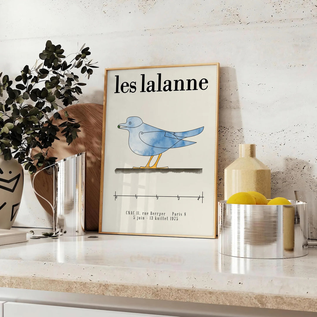Vintage illustration of animals by Les Lalanne in muted gray and green tones - styled on a counter with eucalyptus and a bowl of lemons