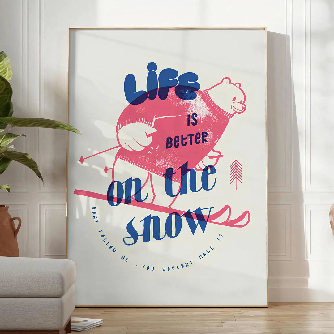 Maximalist poster featuring a snowy landscape with bold blue and white colors - in a bright minimalist room with a plant and an armchair