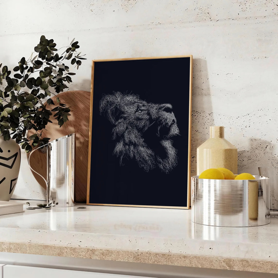 A black lion's head with green accents in a bold, modern style - styled on a counter with eucalyptus and a bowl of lemons