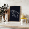 A black lion's head with green accents in a bold, modern style - styled on a counter with eucalyptus and a bowl of lemons