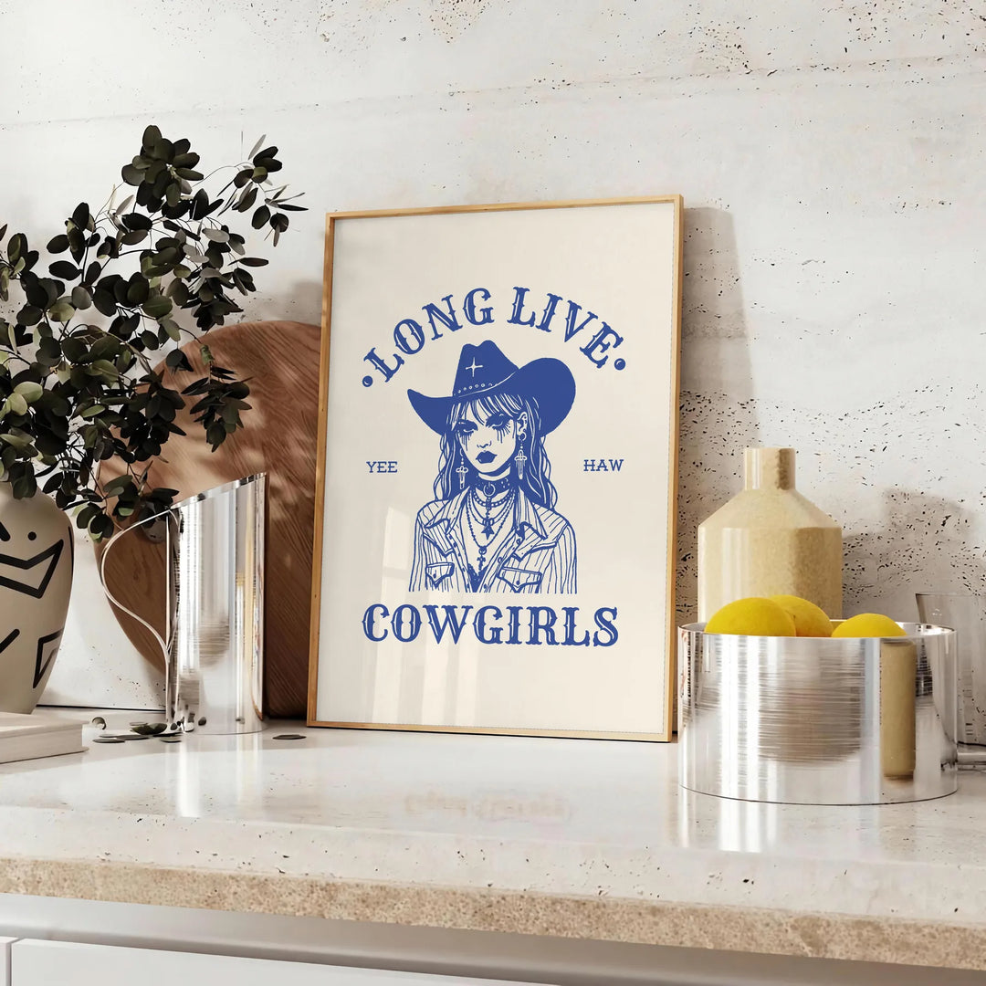 Illustration of a cowgirl in a gray and white Wild West setting - styled on a counter with eucalyptus and a bowl of lemons