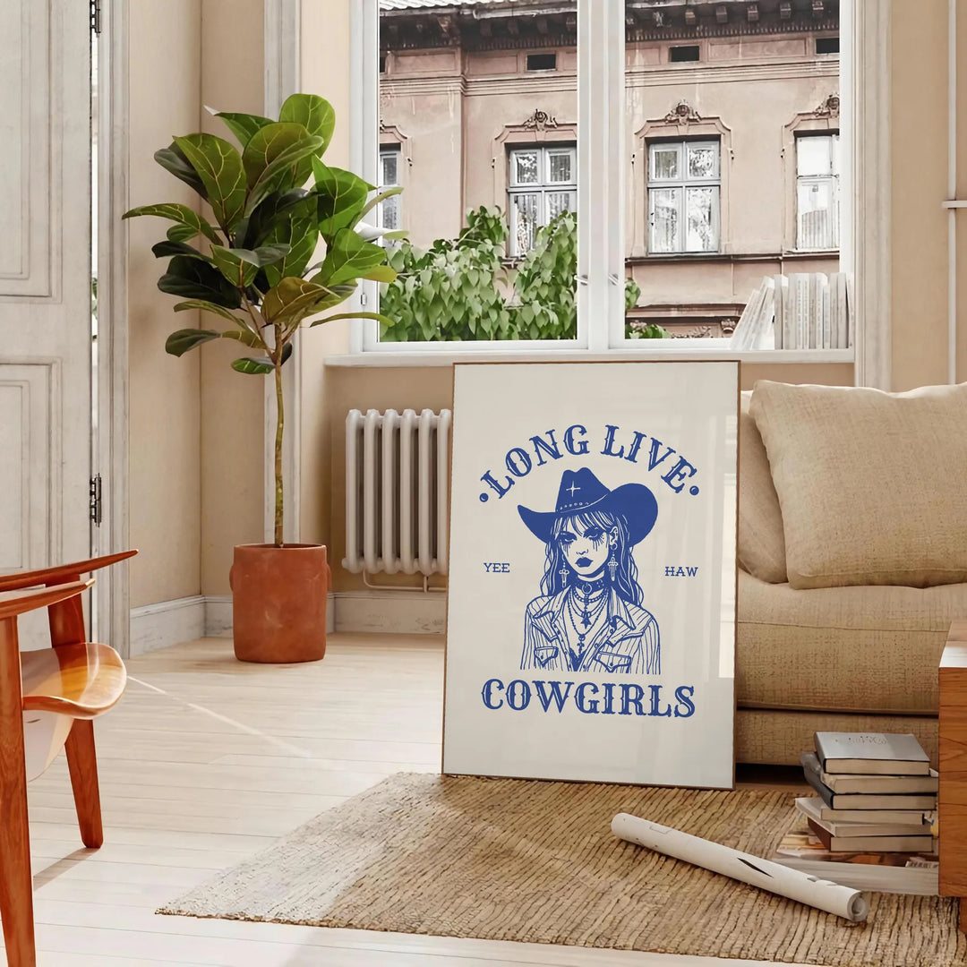 Illustration of a cowgirl in a gray and white Wild West setting - in a Parisian living room with a sofa and a fig plant