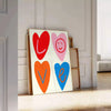 Abstract representation of love in blue and orange hues - leaning on a herringbone floor against a white panelled wall