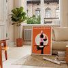 Cocktail-themed artwork featuring wine glasses in a minimalist style with black and brown tones - in a Parisian living room with a sofa and a fig plant