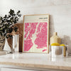 Stylized map of New York City in black and gray tones - styled on a counter with eucalyptus and a bowl of lemons