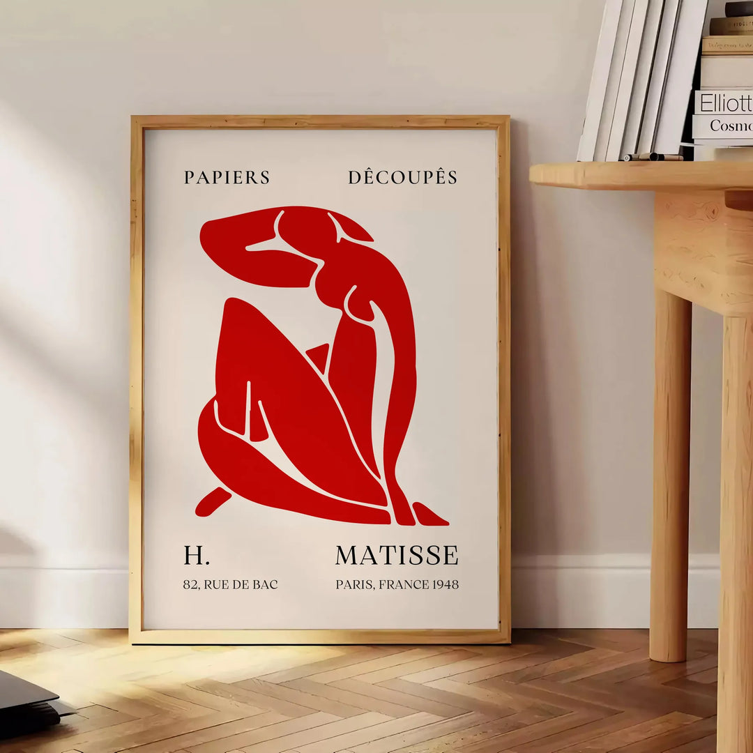 Abstract shapes and bold colors in Matisse style - beside a round wooden side table with books