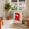 Abstract shapes and bold colors in Matisse style - in a Parisian living room with a sofa and a fig plant