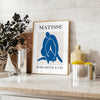 Gray and white Matisse papier découpés poster with abstract organic shapes - styled on a counter with eucalyptus and a bowl of lemons