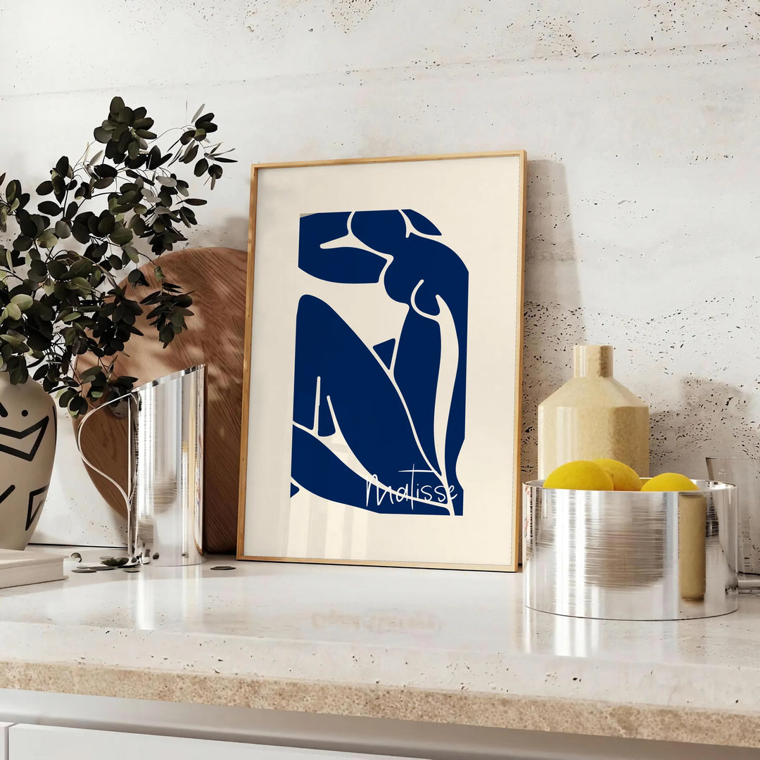 Gray and white cut-out shapes in Matisse's papier découpés style - styled on a counter with eucalyptus and a bowl of lemons