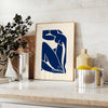 Gray and white cut-out shapes in Matisse's papier découpés style - styled on a counter with eucalyptus and a bowl of lemons