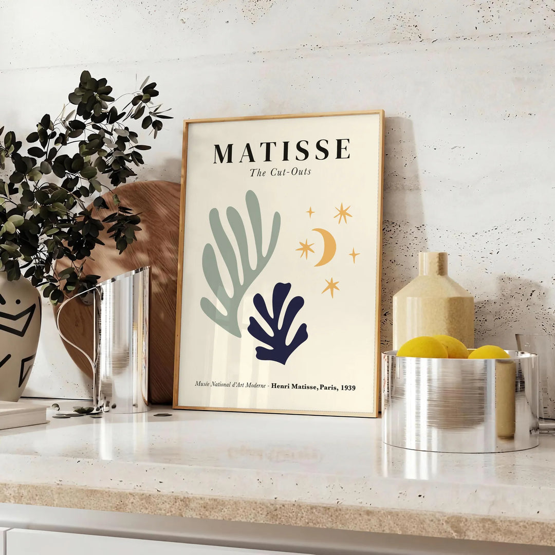 Abstract cut-out shapes in bold colors inspired by Matisse - styled on a counter with eucalyptus and a bowl of lemons