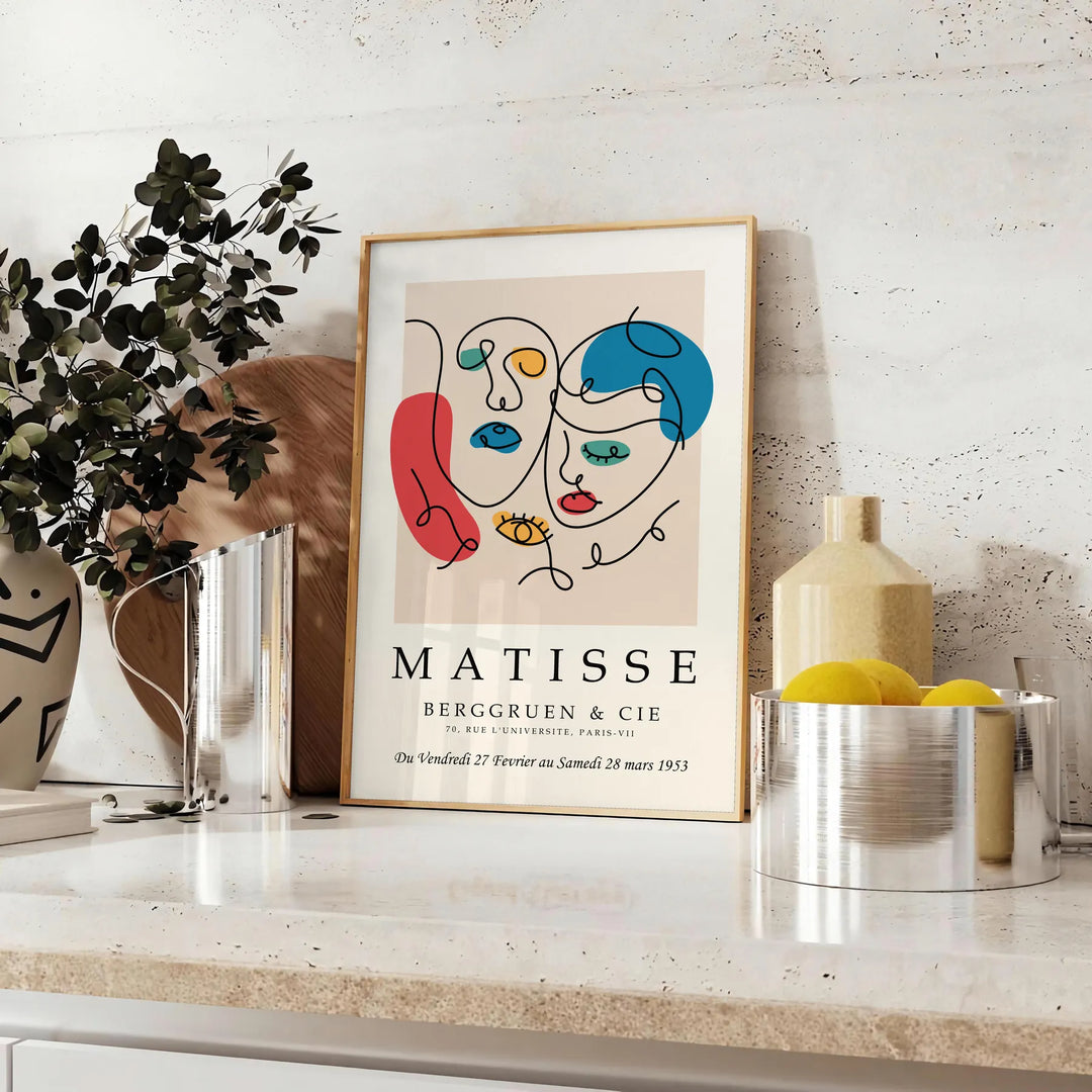 Abstract cut-paper composition in white and yellow by Matisse - styled on a counter with eucalyptus and a bowl of lemons
