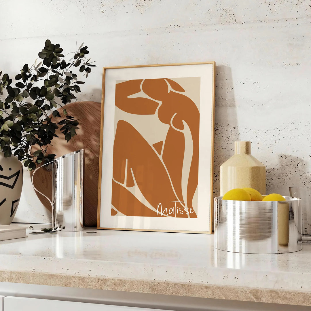 Colorful abstract cut-out shapes in the style of Matisse - styled on a counter with eucalyptus and a bowl of lemons