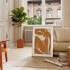 Colorful abstract cut-out shapes in the style of Matisse - in a Parisian living room with a sofa and a fig plant