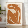 Colorful abstract cut-out shapes in the style of Matisse - in a bright minimalist room with a plant and an armchair