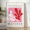 Poster showing Matisse-style papier découpé abstract red and gray shapes - in a bright minimalist room with a plant and an armchair